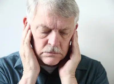 man experiencing discomfort due to TMJ issues