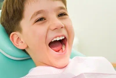 young child laughing during his dental appointment at Florham Park Smile Lounge