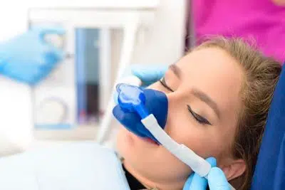 patient receiving laughing gas for their dental procedure at Florham Park Smile Lounge